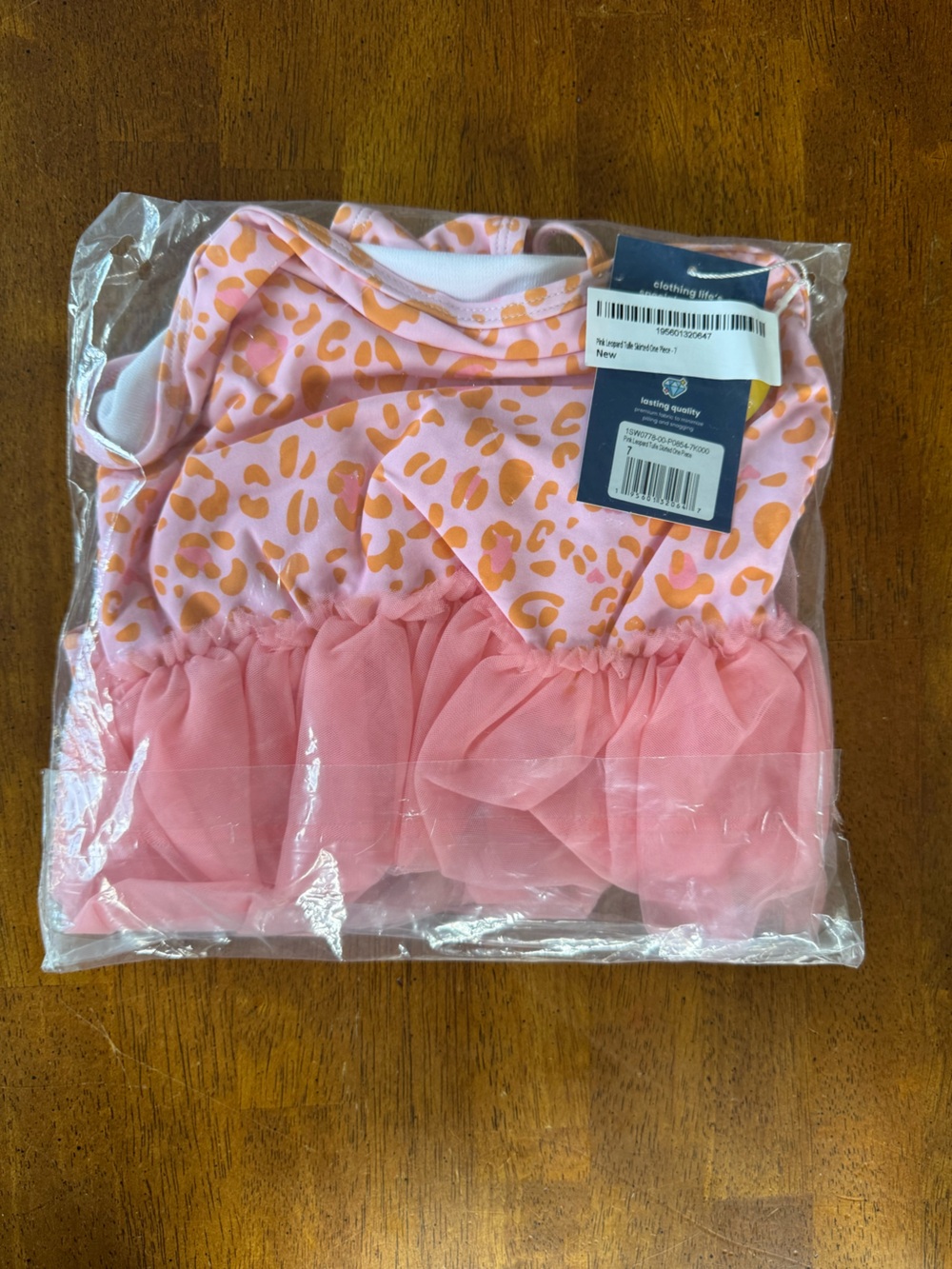 Ruffle Butts Pink One-Piece with Orange Leopard Print and Pink Ruffles